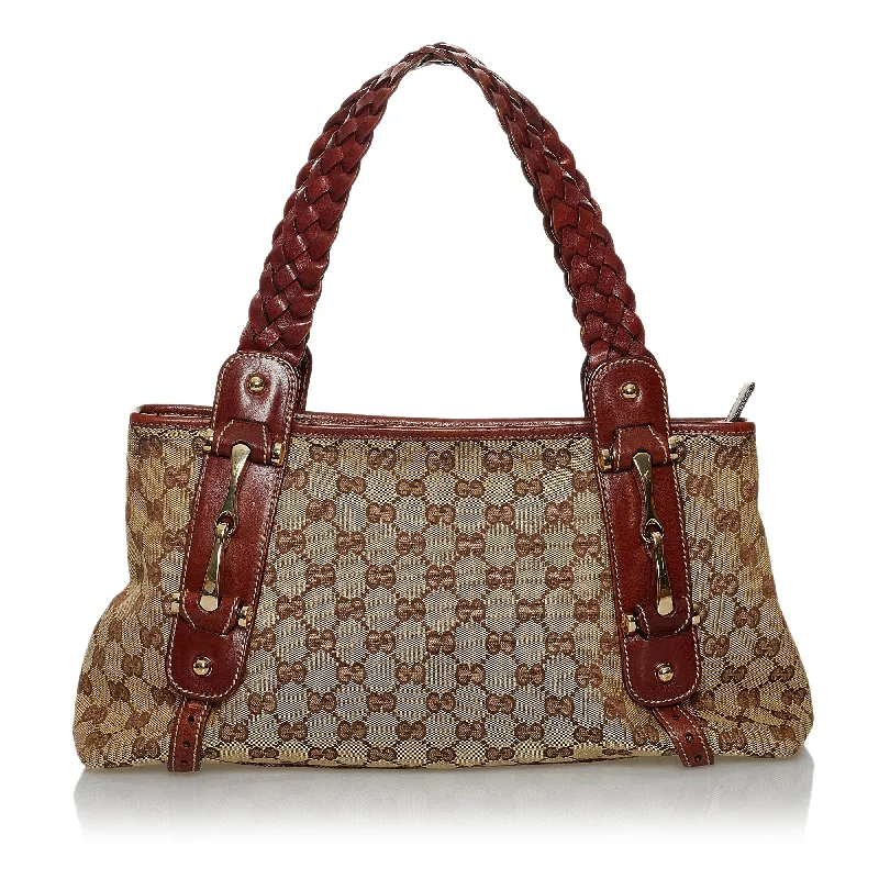 Women Gucci bags with a snap - button closure and a decorative charmWomen Gucci bags with a snap - button closure and a decorative charmGucci GG Canvas Pelham Shoulder Bag