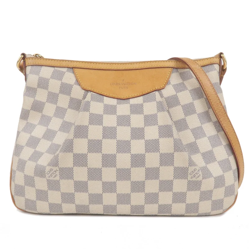 Louis Vuitton Alma bags featuring the signature top - handle designLouis Vuitton Damier Azur Siracusa PM Shoulder Bag N41113