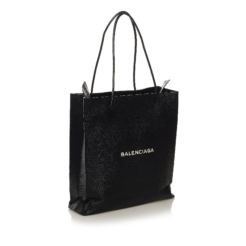 	Balenciaga XS Small bag with hand - painted floral detailsBalenciaga North South Shopping Tote Bag (SHG-34251)