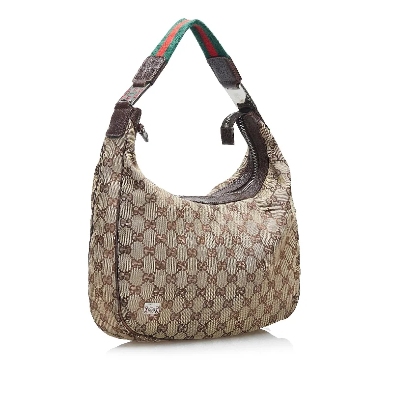 Women Gucci bags with interlocking G hardware for a classic lookWomen Gucci bags with interlocking G hardware for a classic lookGucci GG Canvas Web Shoulder Bag (SHG-F1ykz7)