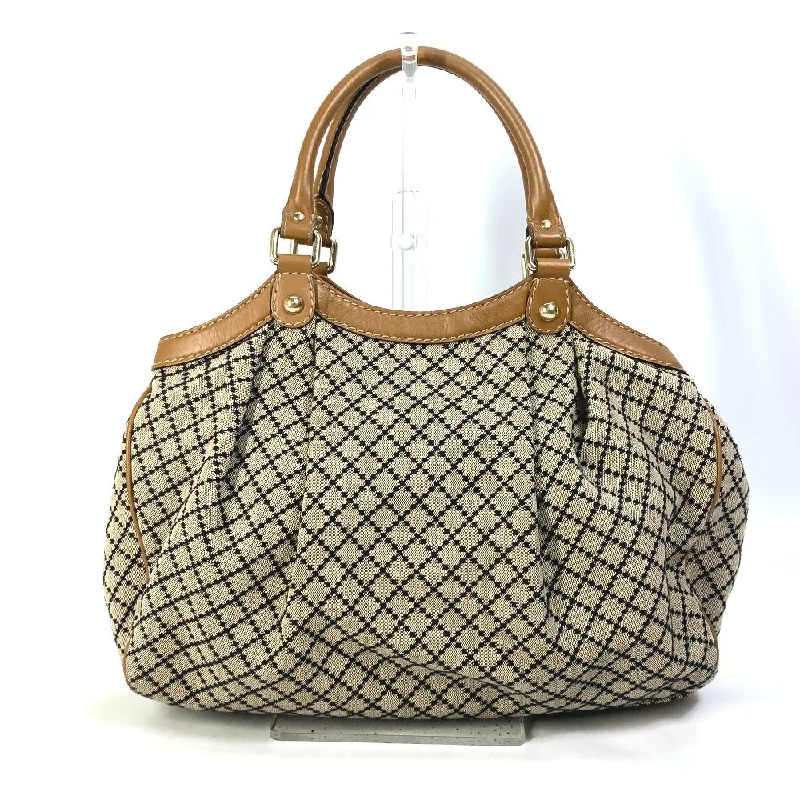 Women Gucci bags with a snap - button closure and a decorative charmWomen Gucci bags with a snap - button closure and a decorative charmGUCCI Tote Bag 211944 Canvas / leather beige Bag Sukey Women Secondhand