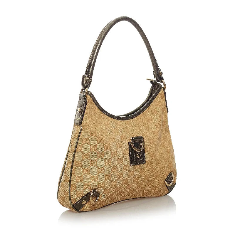 Women Gucci bags with a chain - link trim and a leather bodyWomen Gucci bags with a chain - link trim and a leather bodyGucci GG Canvas Abbey D-Ring Shoulder Bag (29053)